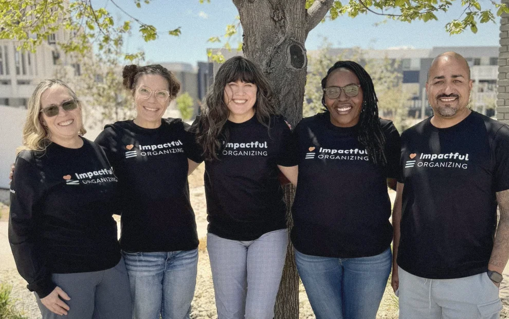 The Impactful Organizing team smiling together